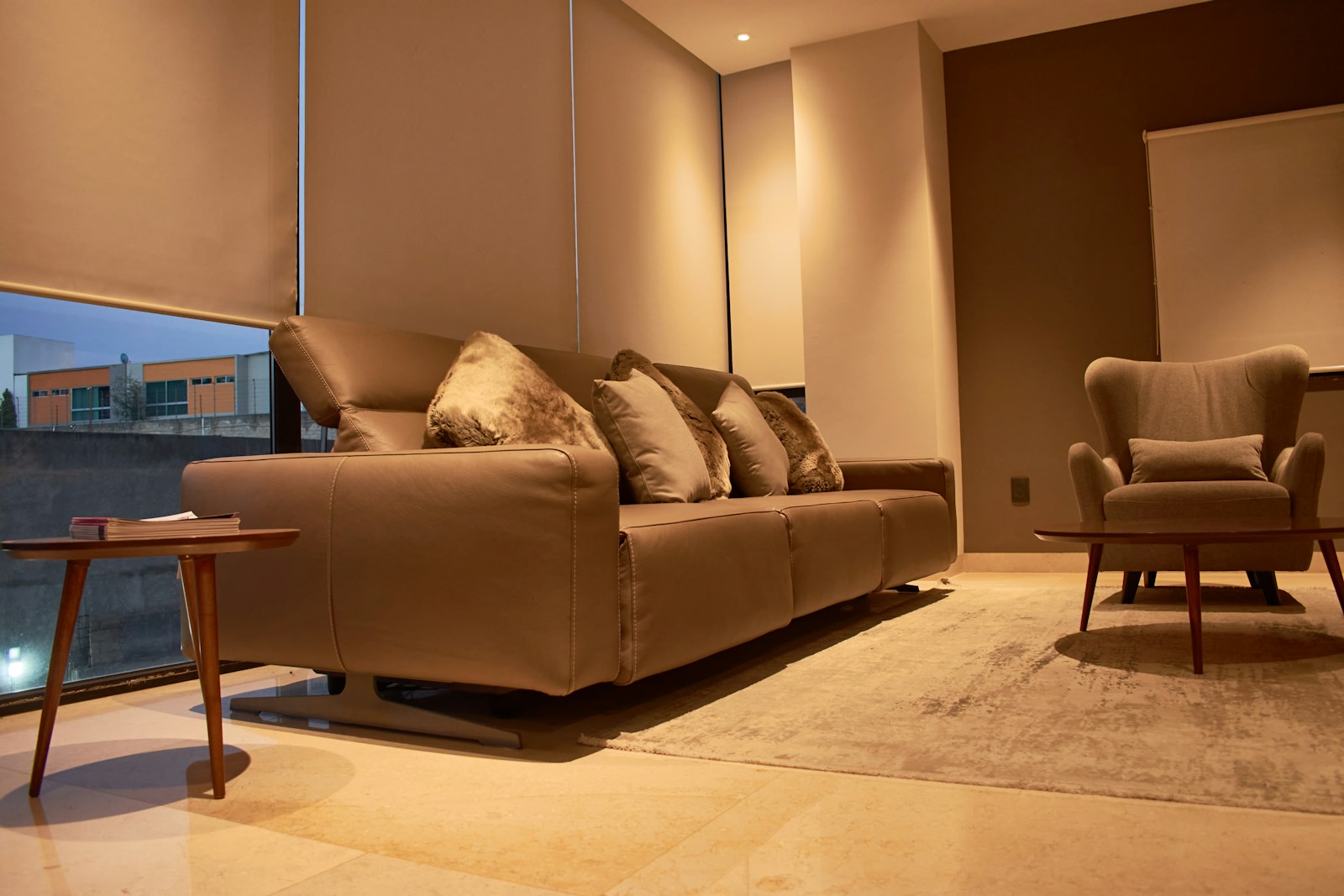 a living room filled with furniture and a large window