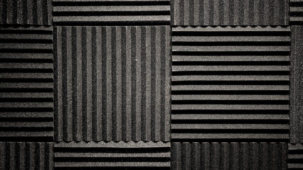 a black and white photo of a wall made of corrugated